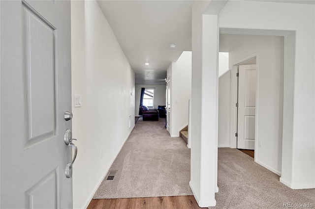 hall with light hardwood / wood-style floors