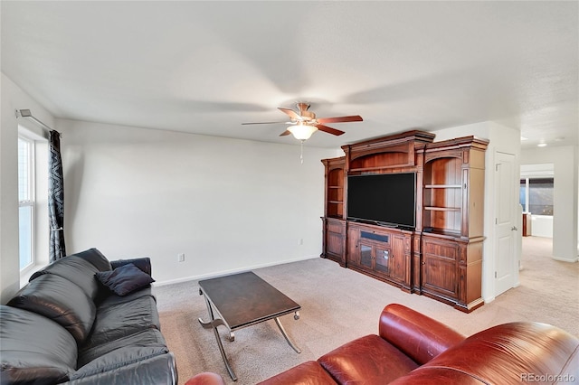 living room featuring ceiling fan and light carpet