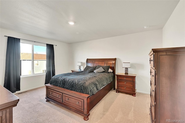 bedroom with light carpet