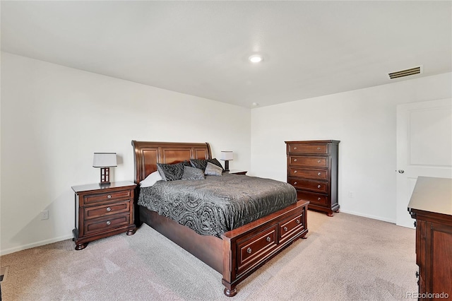 bedroom featuring light colored carpet