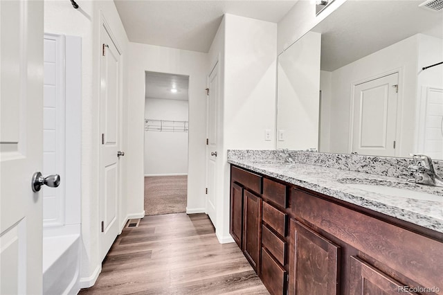 bathroom featuring hardwood / wood-style floors and vanity