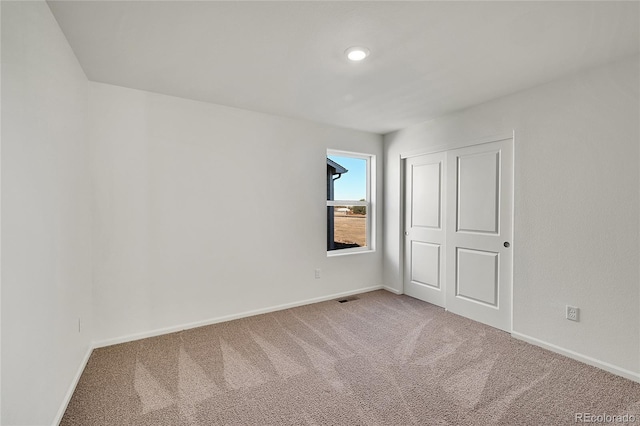 unfurnished room with carpet