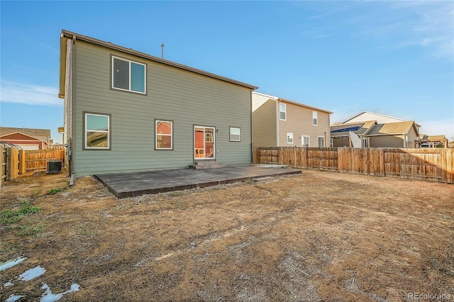 back of property featuring cooling unit and a patio area