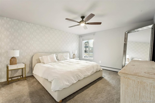 carpeted bedroom with ceiling fan and a baseboard radiator