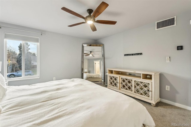 carpeted bedroom with ceiling fan