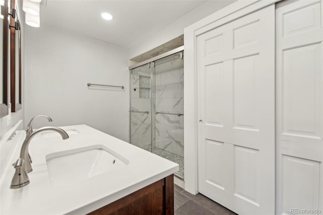 bathroom with vanity and walk in shower