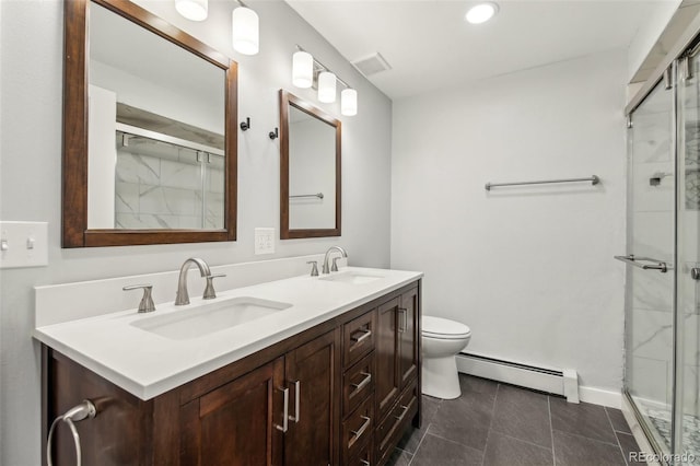 bathroom featuring toilet, a baseboard heating unit, vanity, and a shower with shower door