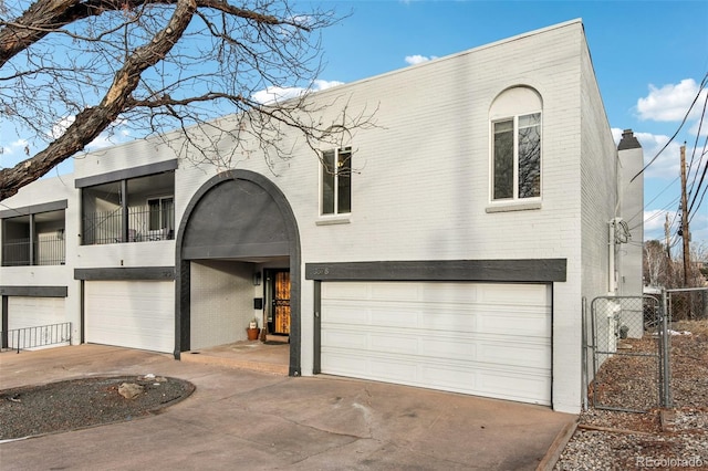 view of front of property with a balcony and a garage