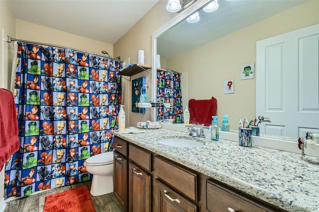 10811 Chambers Way, Commerce City, CO 80022 - bathroom featuring vanity, wood finished floors, toilet, and curtained shower