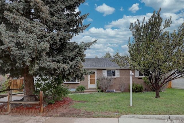 4391 W Tufts Ave, Denver, CO 80236 - view of front of house with brick siding and roof with shingles