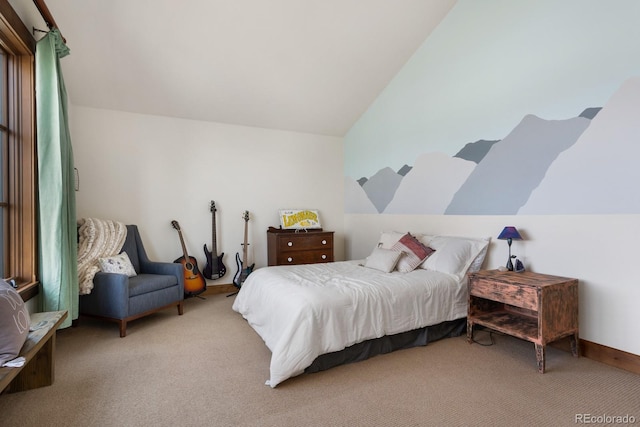 bedroom with carpet flooring and vaulted ceiling
