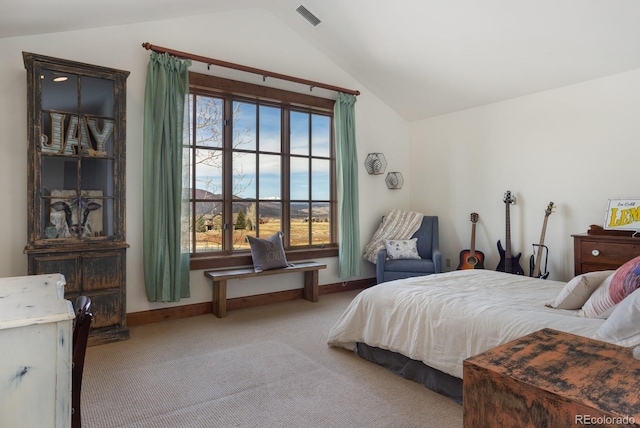 carpeted bedroom featuring baseboards, visible vents, and vaulted ceiling
