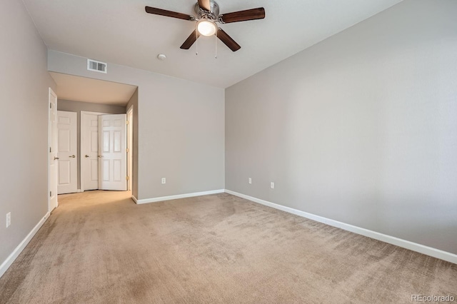 unfurnished bedroom featuring light carpet and ceiling fan