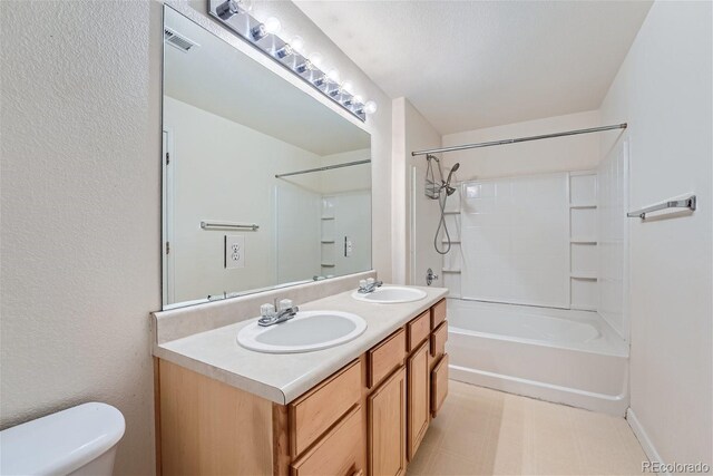 full bathroom featuring bathing tub / shower combination, tile patterned flooring, toilet, and double sink vanity