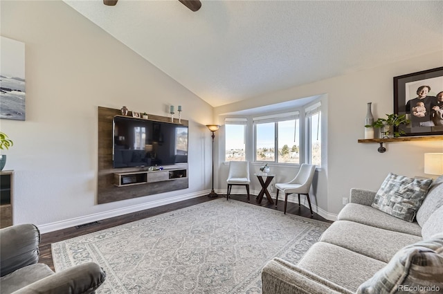 living room featuring visible vents, vaulted ceiling, a textured ceiling, wood finished floors, and baseboards