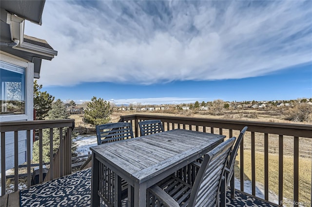 wooden deck featuring outdoor dining space