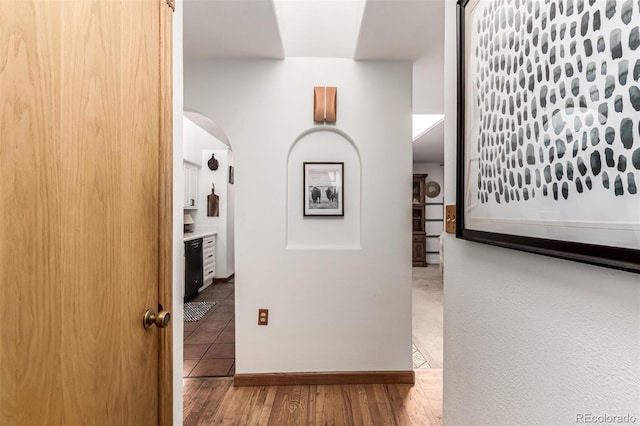 9861 Pecos St, Thornton, CO 80260 - hallway with arched walkways and wood finished floors