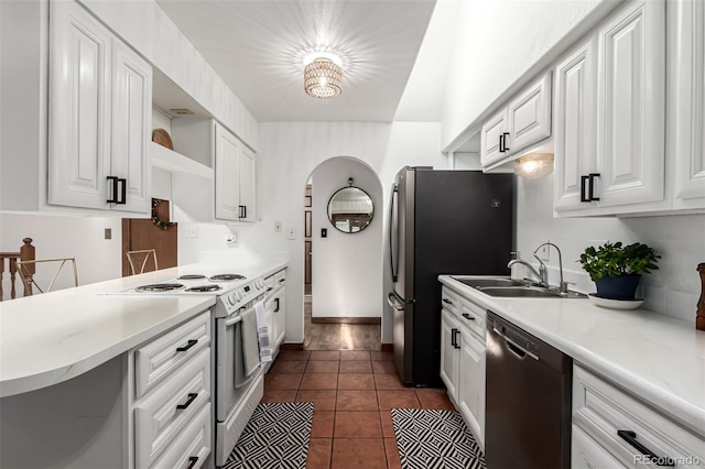 9861 Pecos St, Thornton, CO 80260 - kitchen featuring dishwasher, white range with electric stovetop, open shelves, arched walkways, and white cabinets