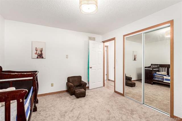 9861 Pecos St, Thornton, CO 80260 - carpeted bedroom featuring a closet and a textured ceiling