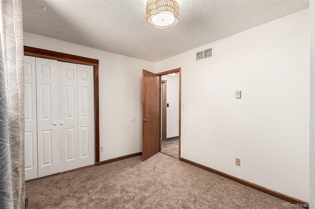 9861 Pecos St, Thornton, CO 80260 - unfurnished bedroom with carpet flooring, a closet, and a textured ceiling