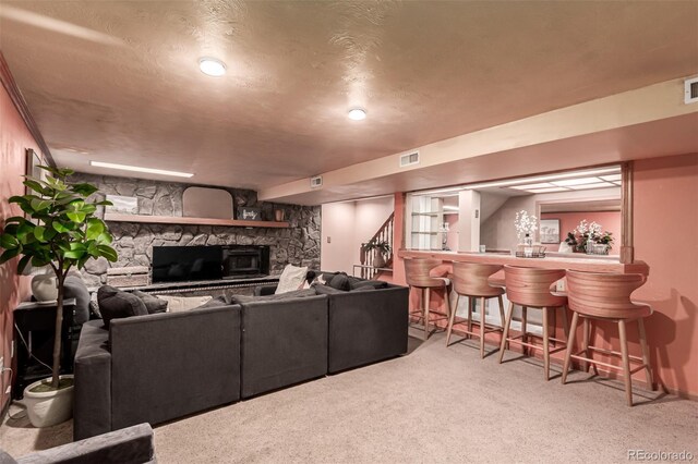 9861 Pecos St, Thornton, CO 80260 - carpeted living area featuring a stone fireplace and bar area