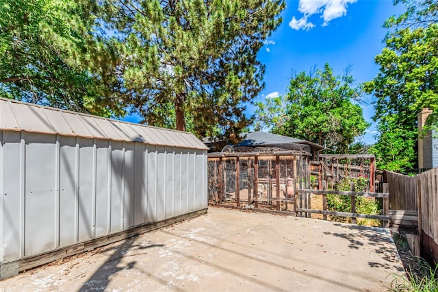 9861 Pecos St, Thornton, CO 80260 - wooden deck with a shed, a fenced backyard, and a patio