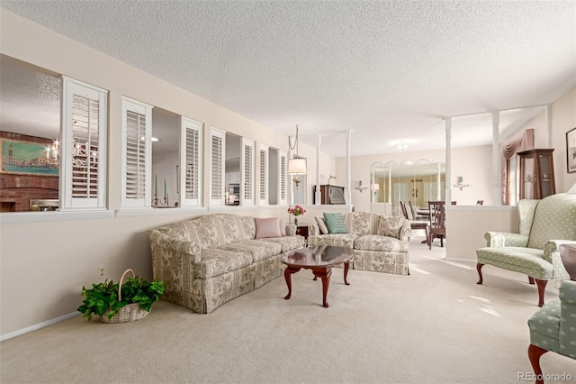 carpeted living room featuring a textured ceiling