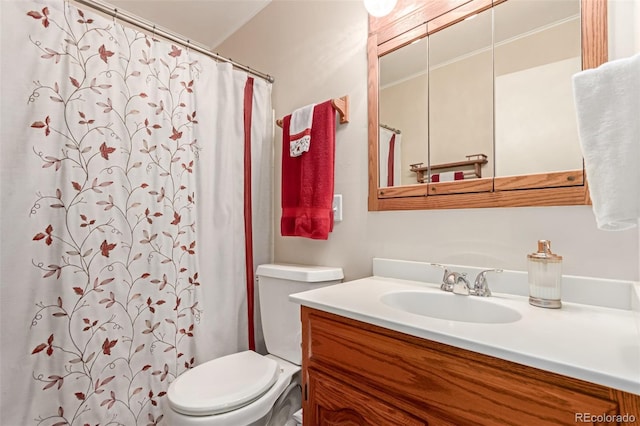 bathroom featuring toilet and vanity