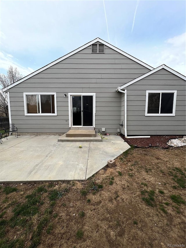 back of house featuring a patio area