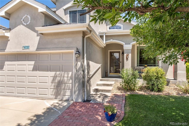 4737 E 127th Ave, Thornton, CO 80241 - view of front facade with stucco siding, concrete driveway, and an attached garage