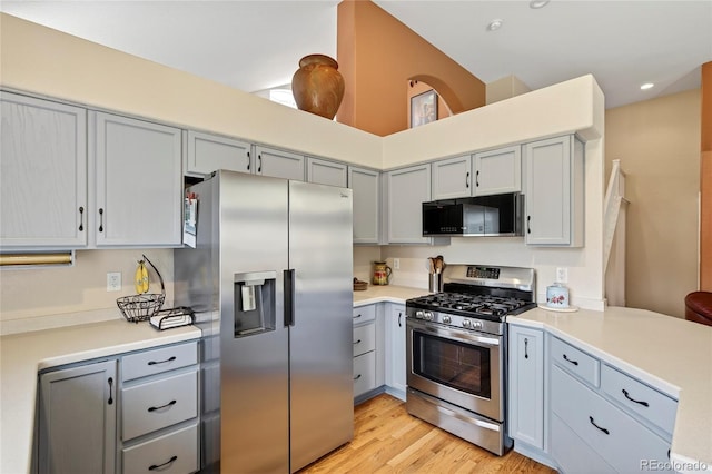 4737 E 127th Ave, Thornton, CO 80241 - kitchen featuring appliances with stainless steel finishes, gray cabinetry, light countertops, light wood-type flooring, and recessed lighting