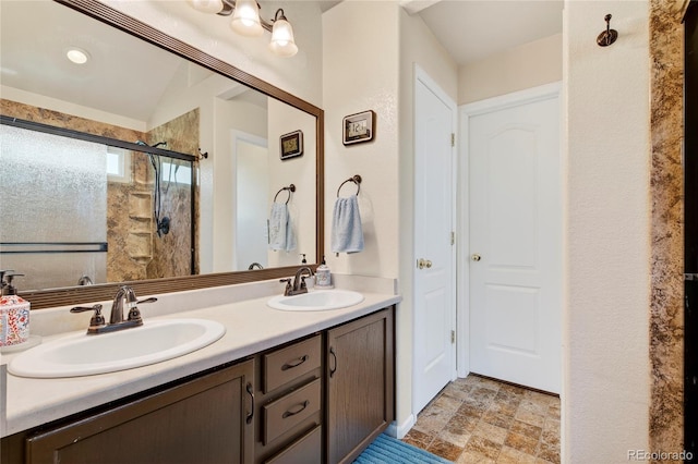 4737 E 127th Ave, Thornton, CO 80241 - bathroom featuring double vanity, a stall shower, and stone finish floors