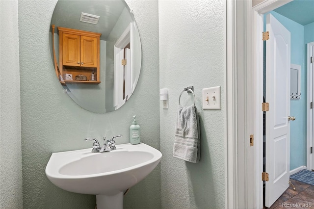 4737 E 127th Ave, Thornton, CO 80241 - bathroom with a sink and a textured wall