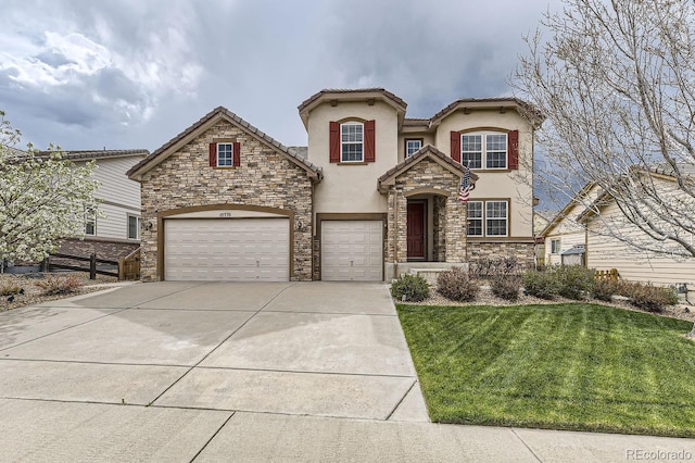 view of front of home featuring a garage, concrete driveway, stone siding, a front lawn, and stucco siding