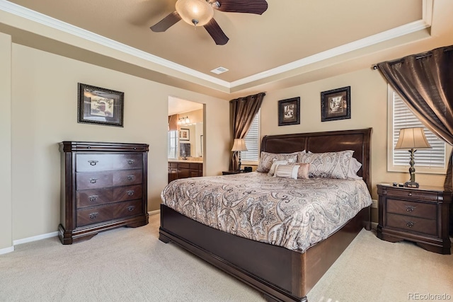 bedroom featuring crown molding, a raised ceiling, visible vents, light carpet, and baseboards