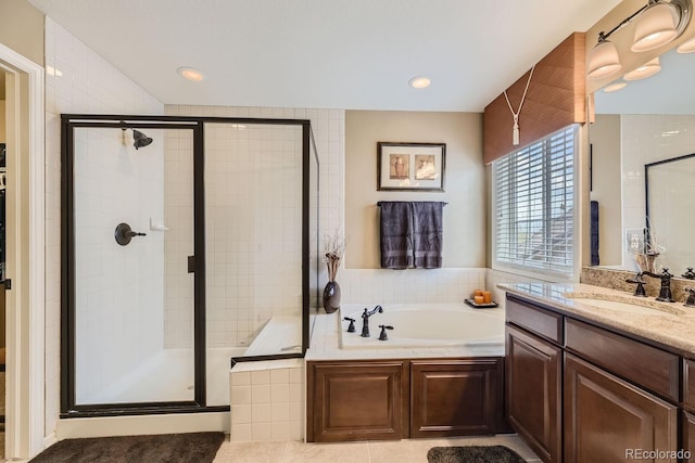 full bathroom featuring a stall shower, vanity, recessed lighting, and a bath