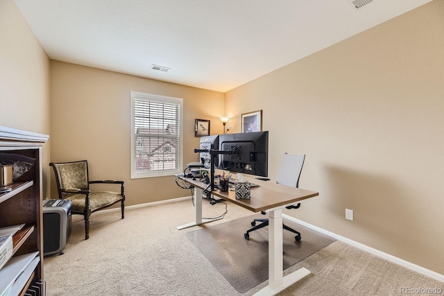 office with carpet, visible vents, and baseboards