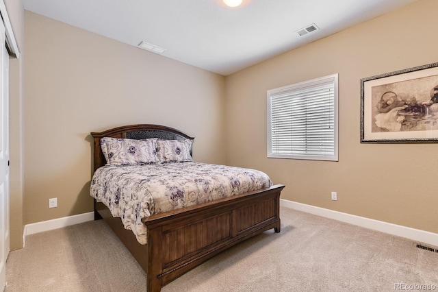 bedroom featuring light carpet, baseboards, and visible vents