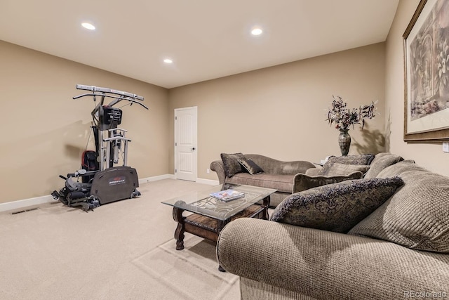 living area with light carpet, recessed lighting, visible vents, and baseboards