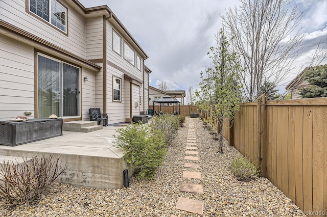 view of yard with a fenced backyard and a patio