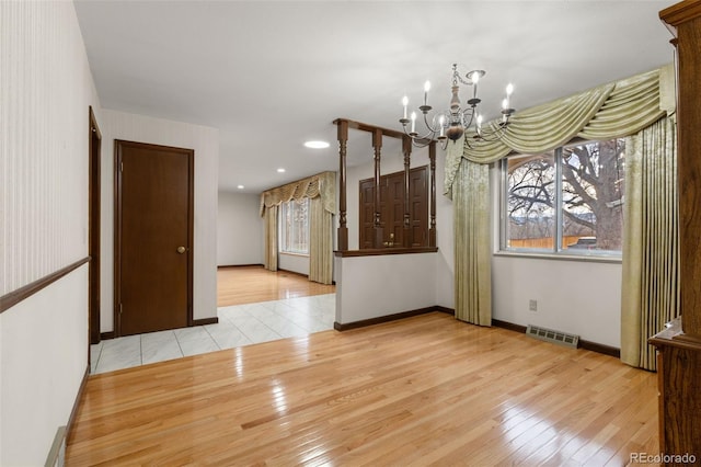 2696 S Yukon Ct, Lakewood, CO 80227 - unfurnished dining area with a chandelier, wood-type flooring, and recessed lighting
