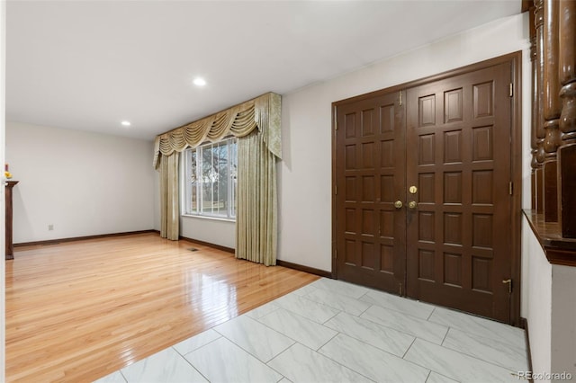 2696 S Yukon Ct, Lakewood, CO 80227 - foyer entrance featuring recessed lighting and light marble finish floors