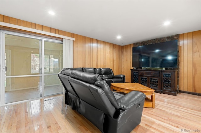 2696 S Yukon Ct, Lakewood, CO 80227 - living area with light wood finished floors and wooden walls