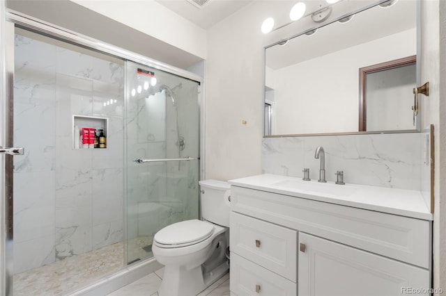 2696 S Yukon Ct, Lakewood, CO 80227 - full bath with vanity, a marble finish shower, marble finish floors, and backsplash