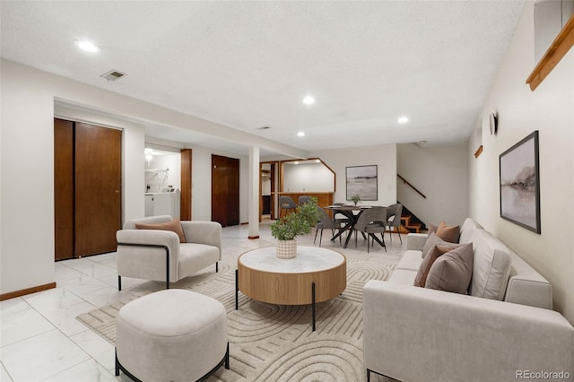 2696 S Yukon Ct, Lakewood, CO 80227 - living room featuring stairs, light marble finish flooring, and recessed lighting