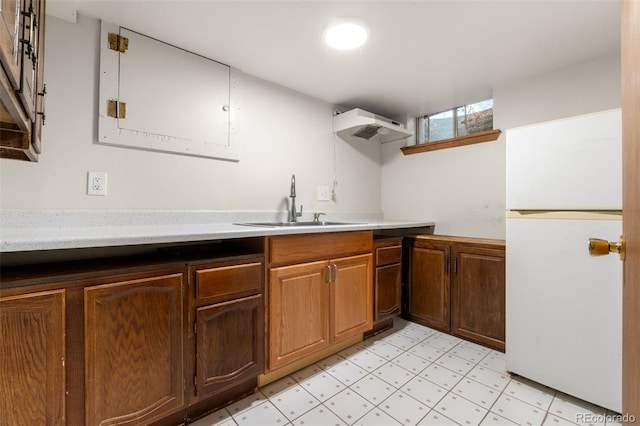 2696 S Yukon Ct, Lakewood, CO 80227 - kitchen with freestanding refrigerator, light countertops, and light floors