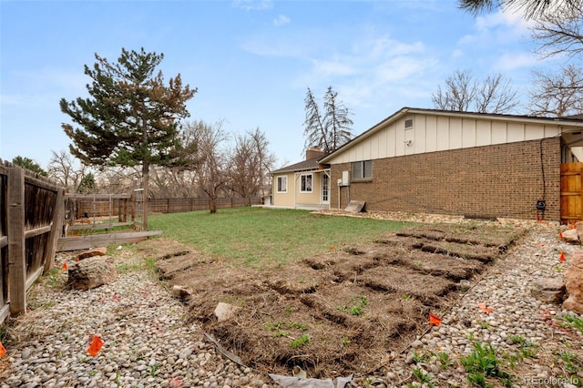 2696 S Yukon Ct, Lakewood, CO 80227 - fenced backyard featuring a garden