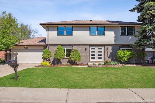 view of front of property with an attached garage, driveway, brick siding, and a front yard