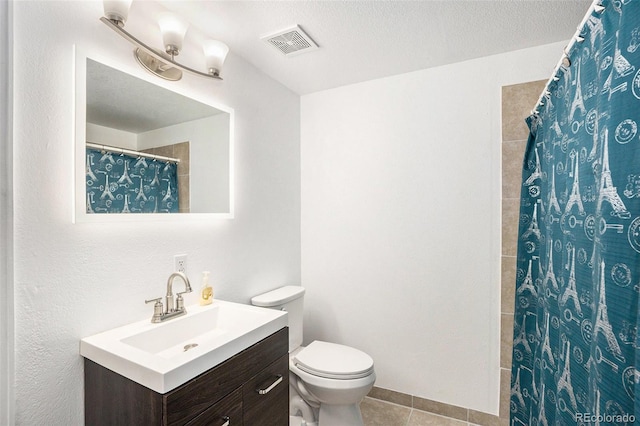 bathroom with visible vents, toilet, vanity, a shower with curtain, and tile patterned floors