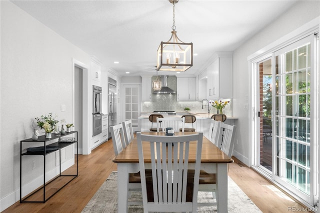 6795 E Kettle Ave, Centennial, CO 80112 - dining room with a chandelier, light wood finished floors, and recessed lighting